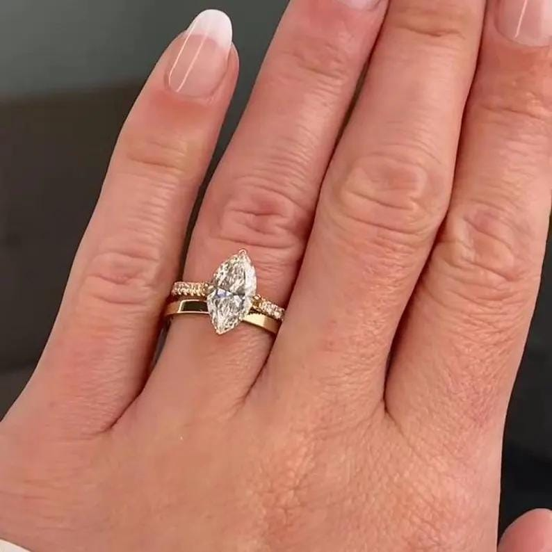 Marquise Diamond Engagement Ring | Gold Wedding Ring Set Marquise diamond engagement ring with gold band and matching wedding ring set.