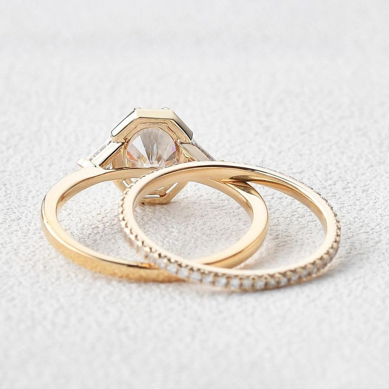 Vintage Oval Diamond Ring | Gold Trilogy Engagement Ring Vintage oval diamond engagement ring with gold trilogy setting and side stones.