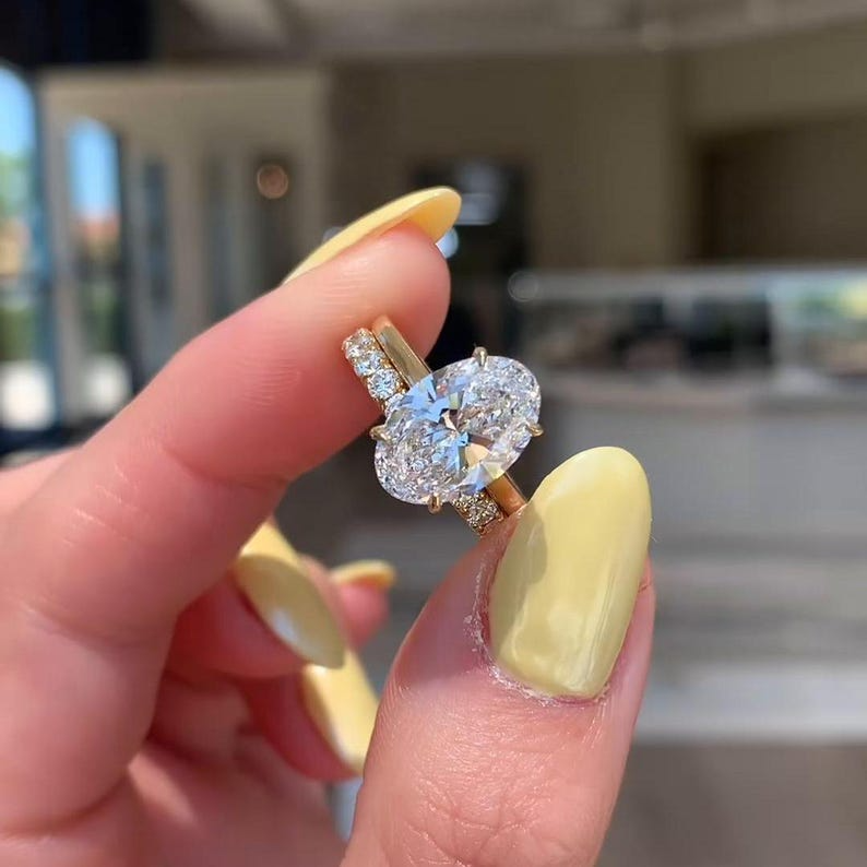 Oval Diamond Halo Ring | Luxury Gold Engagement Ring Oval diamond halo engagement ring with gold band, luxury bridal jewelry.