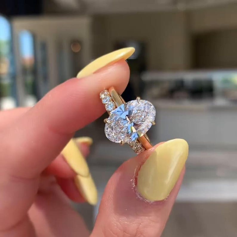 Oval Diamond Halo Ring | Luxury Gold Engagement Ring Oval diamond halo engagement ring with gold band, luxury bridal jewelry.