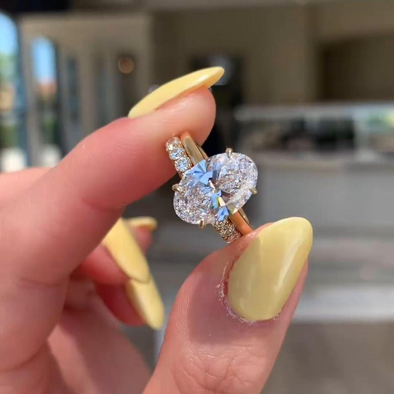 Oval Diamond Halo Ring | Luxury Gold Engagement Ring Oval diamond halo engagement ring with gold band, luxury bridal jewelry.