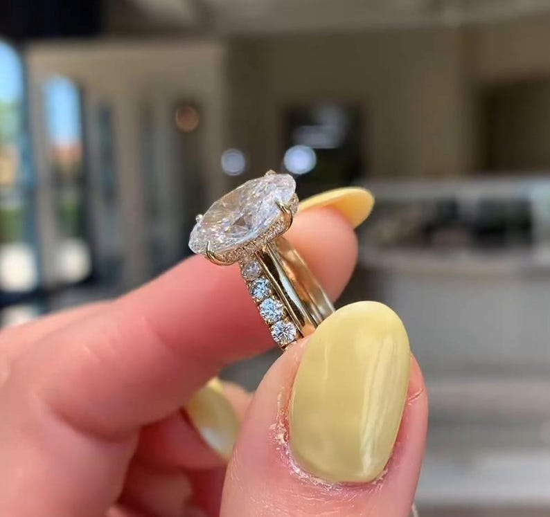 Oval Diamond Halo Ring | Luxury Gold Engagement Ring Oval diamond halo engagement ring with gold band, luxury bridal jewelry.