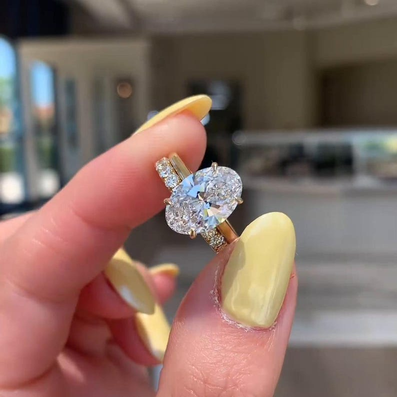 Oval Diamond Halo Ring | Luxury Gold Engagement Ring Oval diamond halo engagement ring with gold band, luxury bridal jewelry.