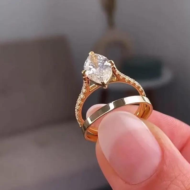 Marquise Diamond Engagement Ring | Gold Wedding Ring Set Marquise diamond engagement ring with gold band and matching wedding ring set.