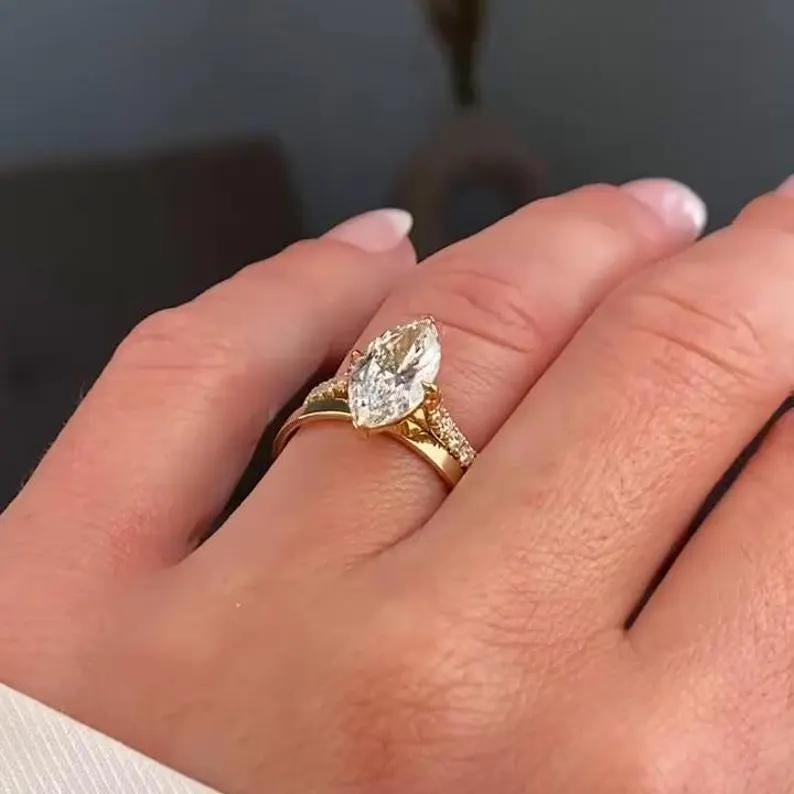 Marquise Diamond Engagement Ring | Gold Wedding Ring Set Marquise diamond engagement ring with gold band and matching wedding ring set.