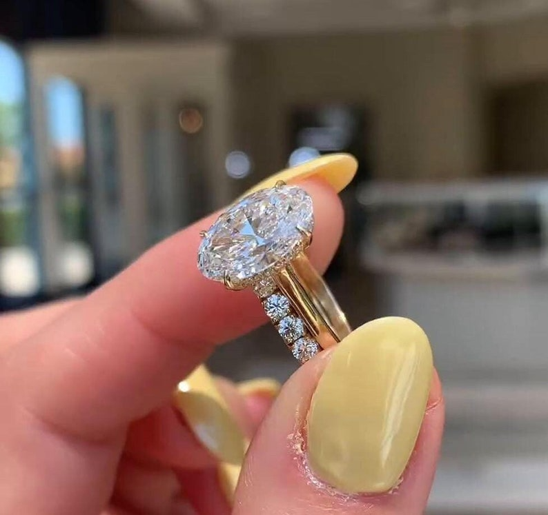 Oval Diamond Halo Ring | Luxury Gold Engagement Ring Oval diamond halo engagement ring with gold band, luxury bridal jewelry.