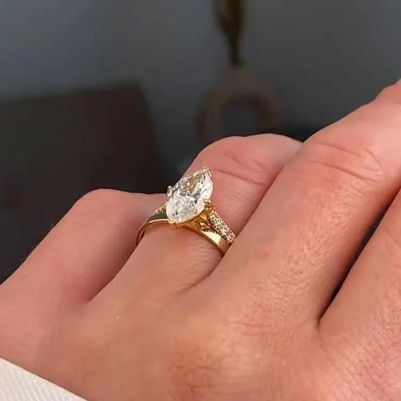 Marquise Diamond Engagement Ring | Gold Wedding Ring Set Marquise diamond engagement ring with gold band and matching wedding ring set.